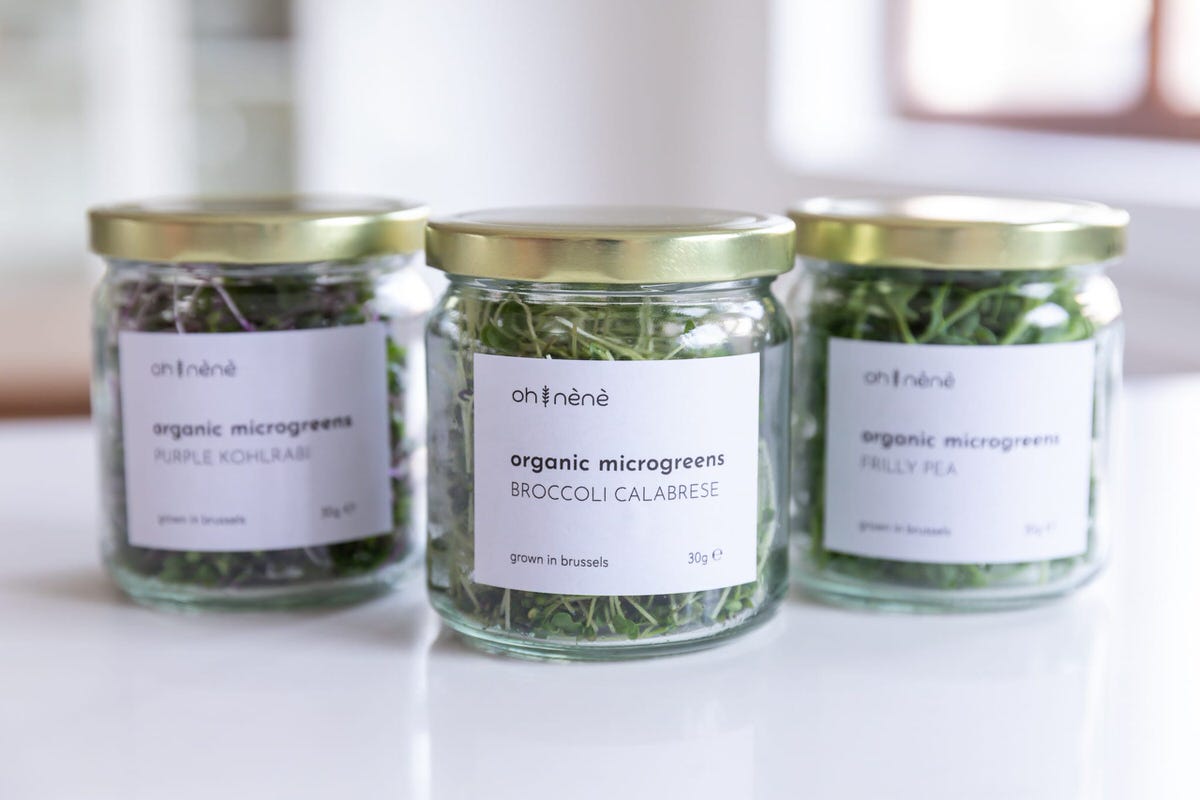 oh nènè microgreens on a glass jar with a label
